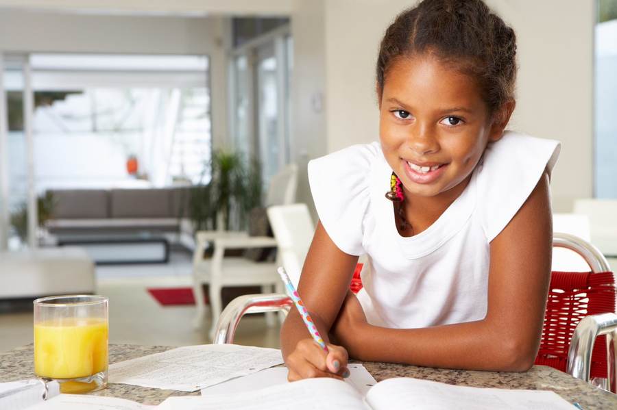 Primary-aged child working at home